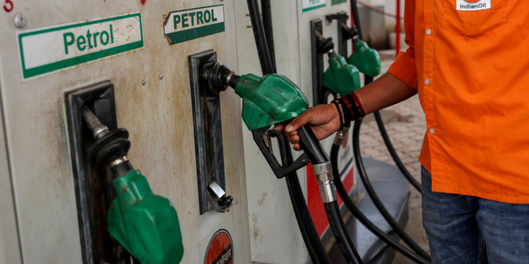 Fuel station attendant returning a fuel pump after fuelling in Kenya. Photo/ file