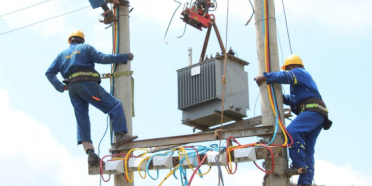 Kenya Power and Lighting Company personnel installing a transformer in undisclosed location in Kenya. PHOTO/ File
