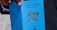 Photo of a Kenyan man holding a passport. PHOTO/ Directorate of Immigration Services