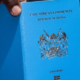 Photo of a Kenyan man holding a passport. PHOTO/ Directorate of Immigration Services