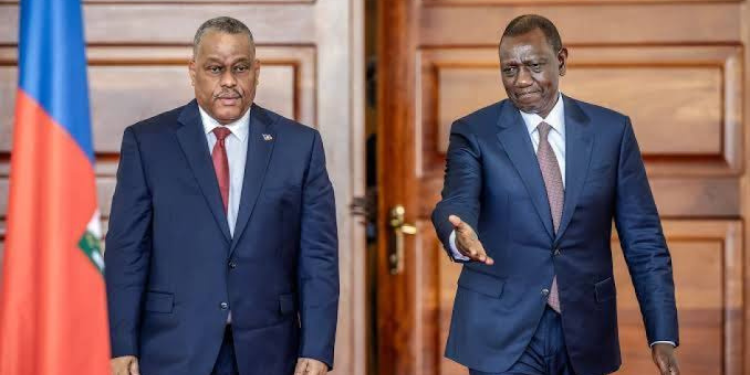 President William Ruto (R) gestures during his arrival to a joint press conference with former Prime Minister of Haiti Garry Conille (L) at the State House in Nairobi on October 11, 2024. Photo by LUIS TATO / AFP