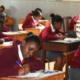 A photo of KCSE candidates at Moi Girls' High School in Eldoret town, Uasin County, tackle an examination paper on November 07, 2023 and an insert of National Identity Cards. PHOTO/Jared Nyataya | Nation Media Group/ Immigration Department FB