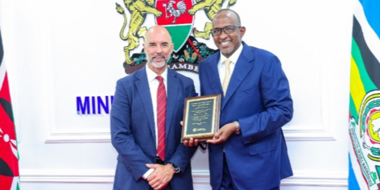 A photo of Health Cabinet Secretary Aden Duale holding a plaque alongside Pfizer Global Emerging Markets President Nick Lagunowich during a high-level meeting at Afya House, Nairobi, on 23rd June 2025. PHOTO/ MoH