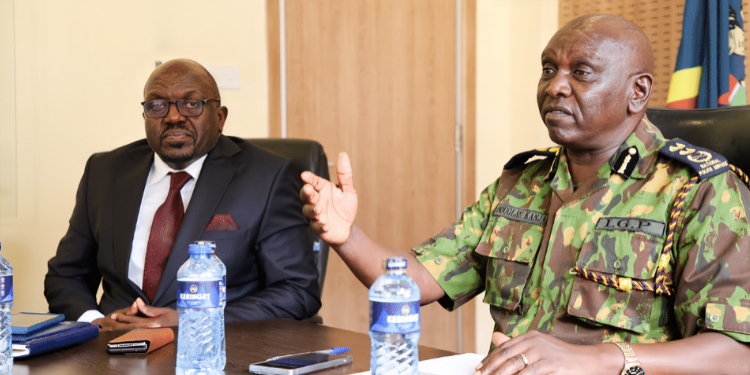 Police IG Douglas Kanja and NPSC CEO Peter Kiptanui Leley during the unveiling of police recruitment system PHOTO/NPSC.