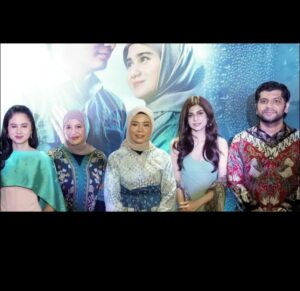 A picture of Norma standing at the centre with white outside with the creators of the film. Image/Jakarta Arts Council Film
