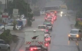 Motorists using a flooded highway during cold and rainy weather in Nairobi