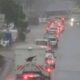 Motorists using a flooded highway during cold and rainy weather in Nairobi