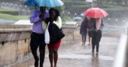 Nairobi residents use umbrellas during a past rainfall in Nairobi, Kenya. PHOTO/Nation.