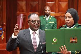 A photo of Dr. Alutalala Mukhwana during the swearing in of IEBC Commissioners in National Assembly