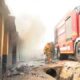Photo of structures on blaze and firefighter vehicle at Fire scene PHOTO/ The Standard