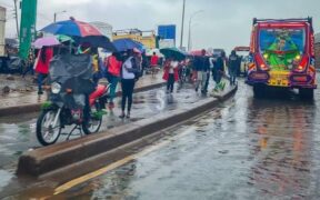 Nairobi residents walking on the streets when it's raining. PHOTO/ The