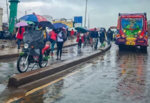 Nairobi residents walking on the streets when it's raining. PHOTO/ The Star