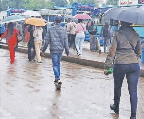 Nairobi residents walking on rainy season. PHOTO/ The Star