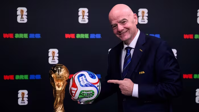 FIFA president Gianni Infantino with the FIFA World Cup trophy and the Official Match Ball of FIFA World Cup 26. PHOTO/Inside FIFA.