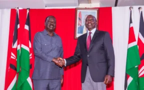 Former Prime Minister Raila Odinga shakes hands with President William Ruto after the two signed a coooperation agreement at KICC on March 7, 2025. PHOTO