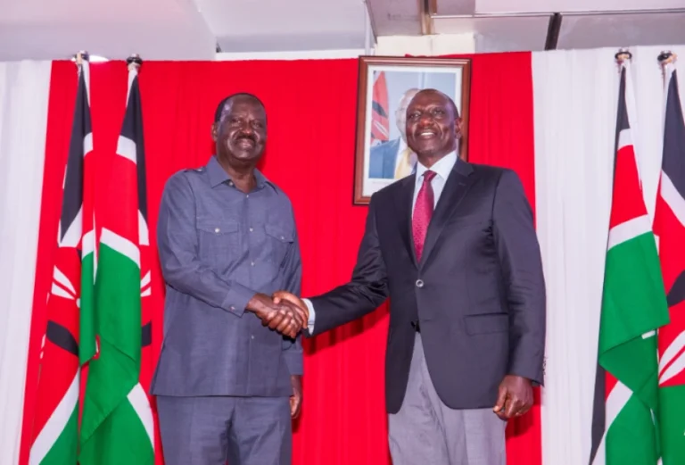 Former Prime Minister Raila Odinga shakes hands with President William Ruto after the two signed a coooperation agreement at KICC on March 7, 2025. PHOTO