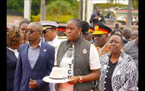 Winnie Odinga with his father hat at JKIA. PHOTO/UGC.