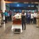 Winnie Placing the icon hat on the casket Image/X