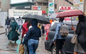 Nairobi residents walking in the rain. PHOTO/FILE