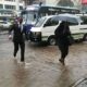 Section of Nairobi residents walking in rain. PHOTO/S