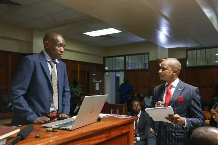Babu Owino and DCI officer at Milimani Law Courts on November 25, 2025. PHOTO/Owino FB