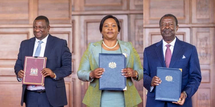 From left: Trade CS Salim Mvurya, Tourism CS Rebecca Miano, and Prime CS Musalia Mudavadi holding the agreements between Kenya and Malaysia. PHOTO/PCS. Ruto