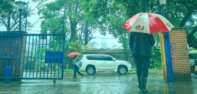 Man walking in the rain with an umbrella. PHOTO/courtesy