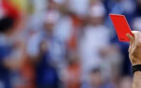 Referee showing a player a red card in the 2018 World Cup. PHOTO/ The Guardian.