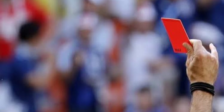 Referee showing a player a red card in the 2018 World Cup. PHOTO/ The Guardian.