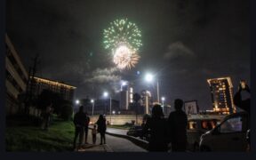 A family gathers along Wangari Mathai road to witness fireworks display at GTC in Nairobi to mark the New Year celebration on January 1,2025/ Star