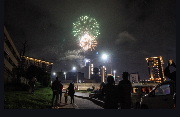 A family gathers along Wangari Mathai road to witness fireworks display at GTC in Nairobi to mark the New Year celebration on January 1,2025/ Star