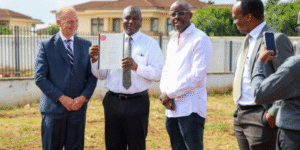 Trevor Kanja, The One Holding the Certificate With Fellow Associates During The Ground Breaking of Galleria Shopping Mall. PHOTO/ Courtesy 