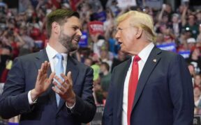 Former President Donald Trump and Republican vice presidential candidate Sen. J.D. Vance, R-Ohio, arrive a campaign rally on Saturday in Grand Rapids, Mich. Evan Vucci/A