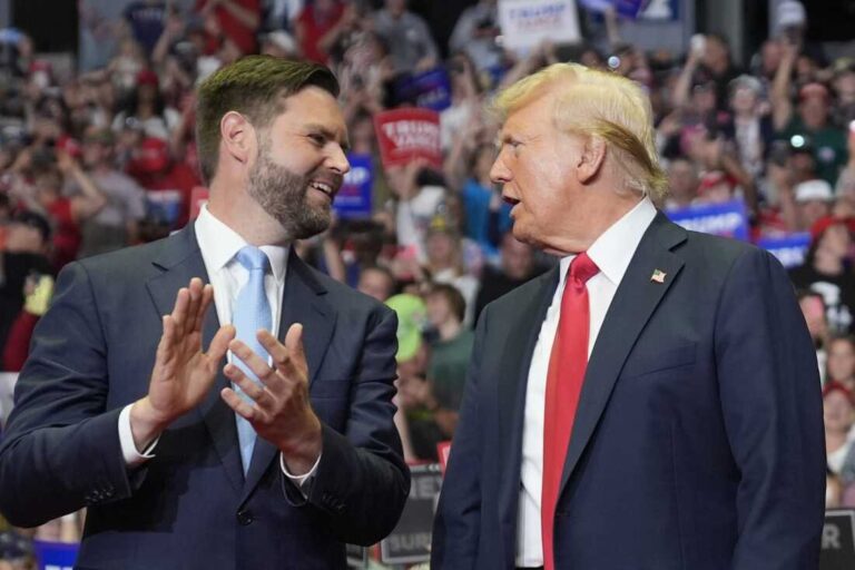 Former President Donald Trump and Republican vice presidential candidate Sen. J.D. Vance, R-Ohio, arrive a campaign rally on Saturday in Grand Rapids, Mich. Evan Vucci/A