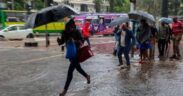 Nairobi residents walking in the rain. PHOTO/S