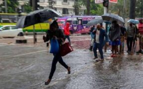 Nairobi residents walking in the rain. PHOTO/S