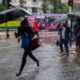 Nairobi residents walking in the rain. PHOTO/S