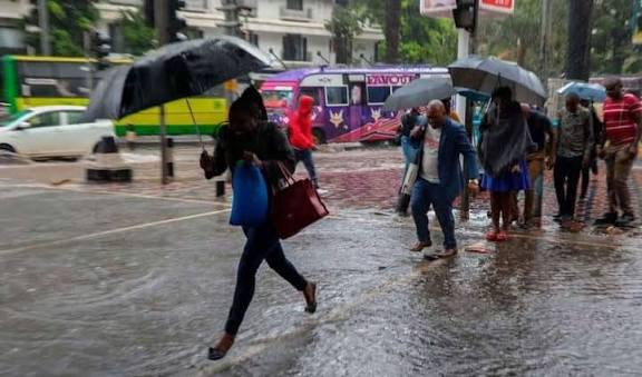 Nairobi residents walking in the rain. PHOTO/S