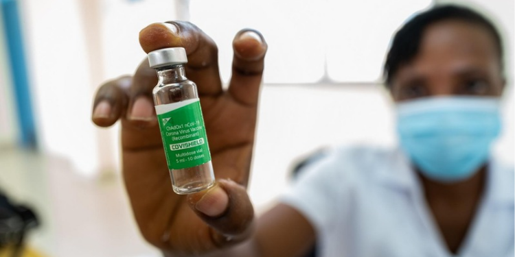 The Image Shows a Healthcare Worker Holding a Vial of the Covishield COVID-19 vaccine. PHOTO/ WHO