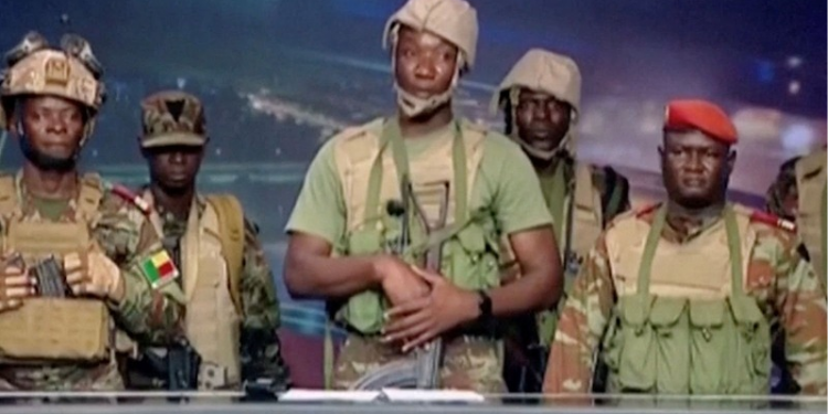 A group of soldiers gives a statement on Benin's national television, claiming to have seized power, following reports of a coup attempt underway against the government of Benin's President Patrice Talon, in Cotonou, Benin, on December 7, 2025. Photo credit: Reuters