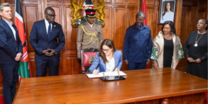 Her Majesty Queen Mary of Denmark Signing the Visitors Book at the Ministry of Foreign Affairs Alongside Kenyan Government Officials. PHOTO/ Mudavadi X 
