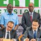 Amsons Group Managing Director, Mr Edha Nahdi (foreground left) and Sinoma CBMI Chairman, Mr Zhang Sicai (fore right), signing the US$250 million Matuga Clinker Factory Construction contract, witnessed by President William Ruto, Bamburi Cement Plc Chairman John Simba, MITI CS Lee Kinyanjui and Bamburi Cement Head of Legal and Company Secretary Joyce Munene.