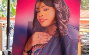 Betty-Bayos-portrait-during-her-burial-service