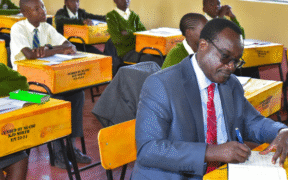 Education CS Julius Ogambo sitting in a classroom. PHOTO/NA