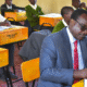Education CS Julius Ogambo sitting in a classroom. PHOTO/NA