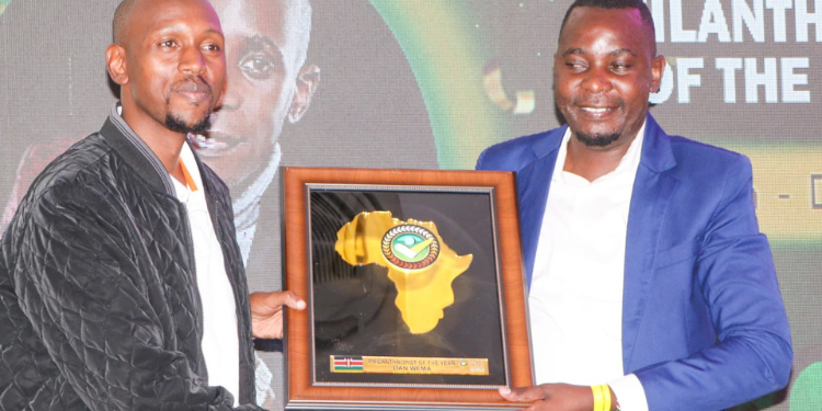 Geoffrey Mosiria receiving prestigious award. PHOTO/Courtesy