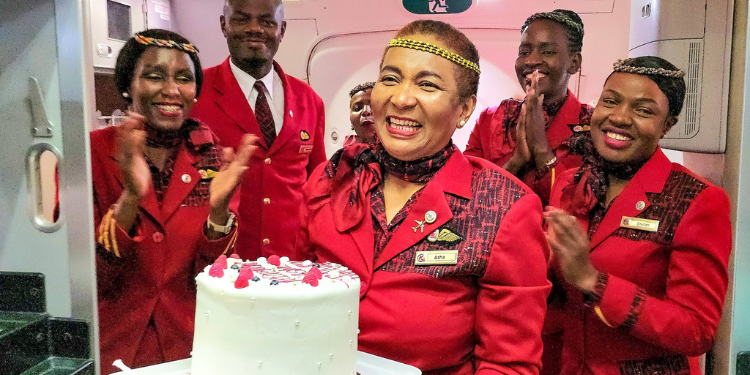 Asha Mohamed with the crew of Kenya Airways. PHOTO/KQ X