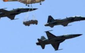 Kenya Air Force KDF Puma aircraft (hoisting a Land Rover) and fighter jets during the Kenya Air Force Golden Jubilee celebrations at Moi Air Base Eastleigh, Nairobi on 4 June 4, 2014.