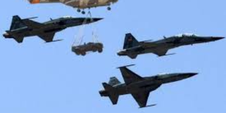 Kenya Air Force KDF Puma aircraft (hoisting a Land Rover) and fighter jets during the Kenya Air Force Golden Jubilee celebrations at Moi Air Base Eastleigh, Nairobi on 4 June 4, 2014.