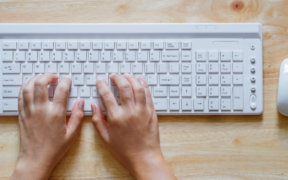 A hand on a computer keyboard for illustration. PHOTO/ Digital Unite.
